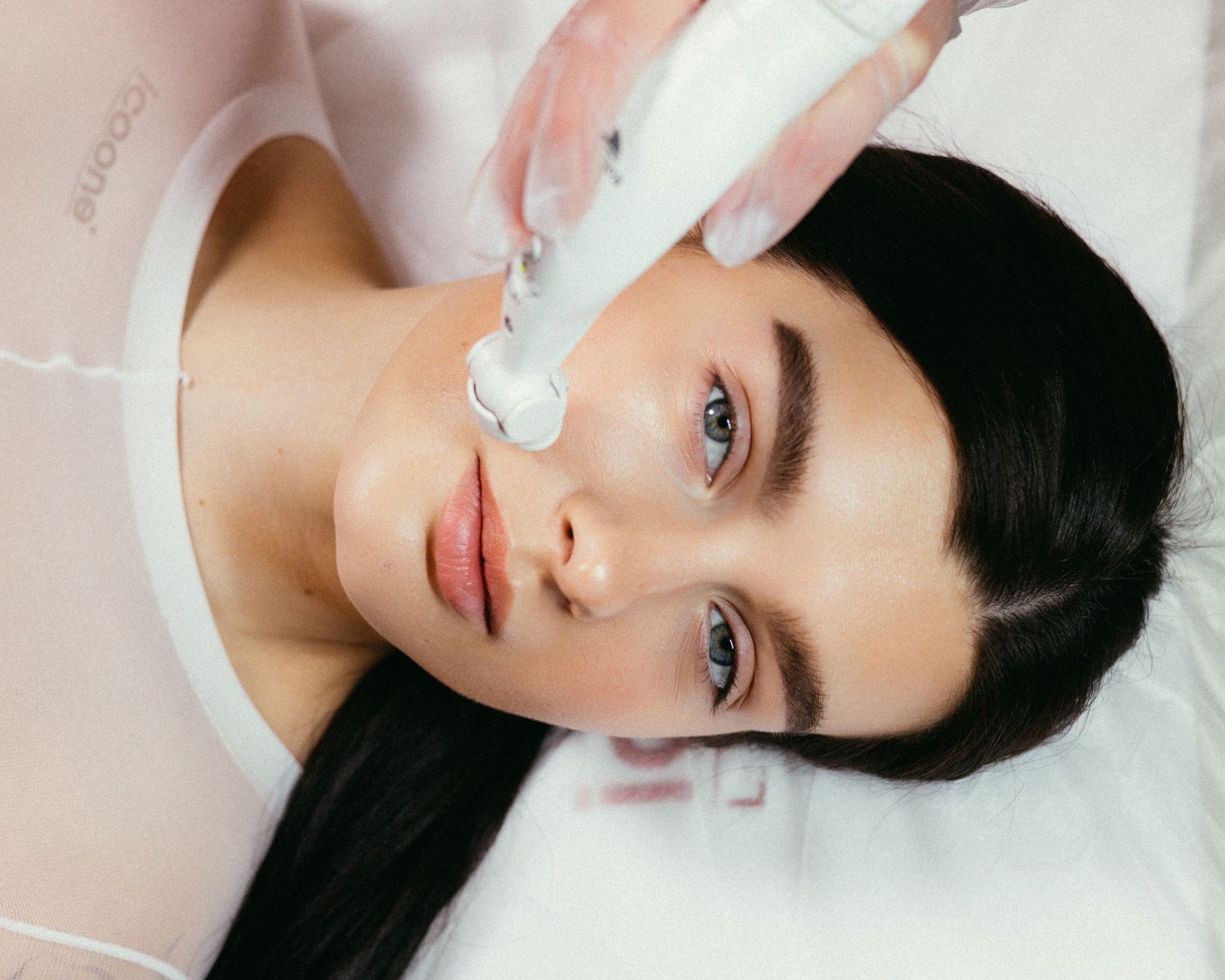 Device-led facial treatment in progress